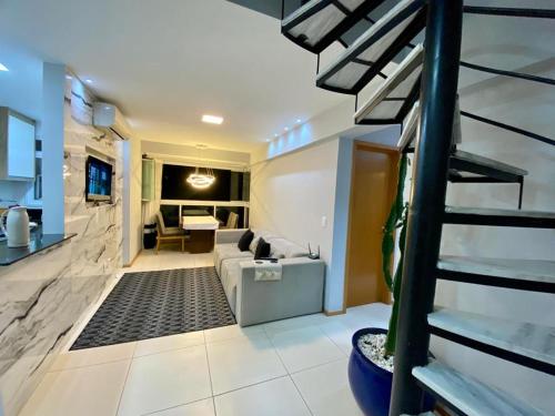Cobertura Duplex Encantadora com jacuzzi Privativa Vista marにあるテレビまたはエンターテインメントセンター
