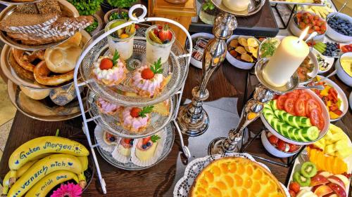 a table with a bunch of different types of food at Boutique Hotel POST ANDECHS in Andechs