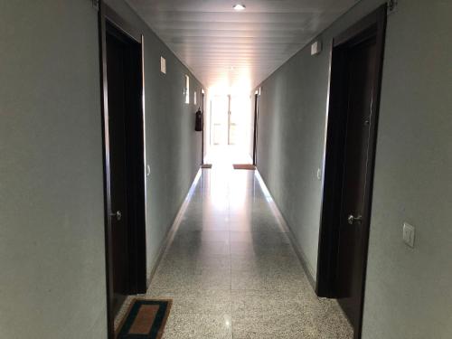 an empty hallway with a door leading to a room at Lujoso Loft La Moraleja in Madrid