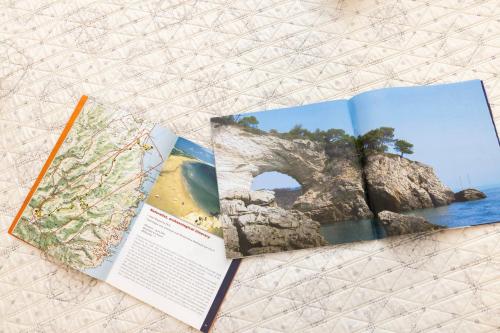 an open book with a picture of a bridge at Agriturismo I Tesori del Sud Vieste, Puglia in Vieste