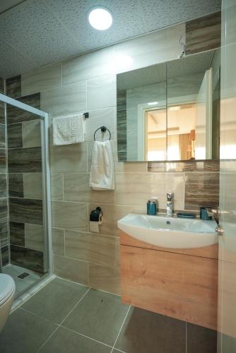 a bathroom with a sink and a shower at Soul House Kuşadası in Kuşadası