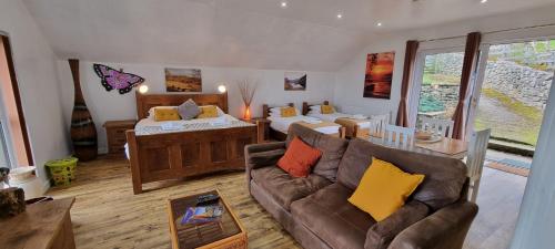 a living room with a couch and a bedroom at Windsor Cottage for Scafell and Wasdale in Nether Wasdale
