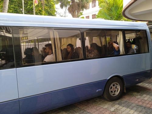 a group of people sitting in a bus at Vino Villa Tourists & Local Accommodations - 24 Hrs in Kandy