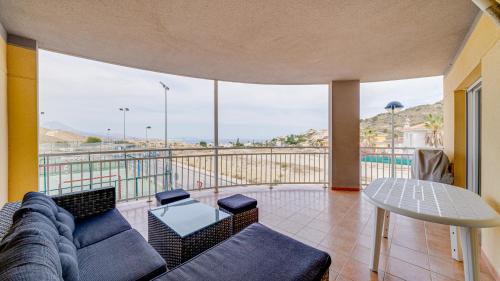 a living room with a couch and a table at Piso en El Poblet 3 dormitorios in El Campello
