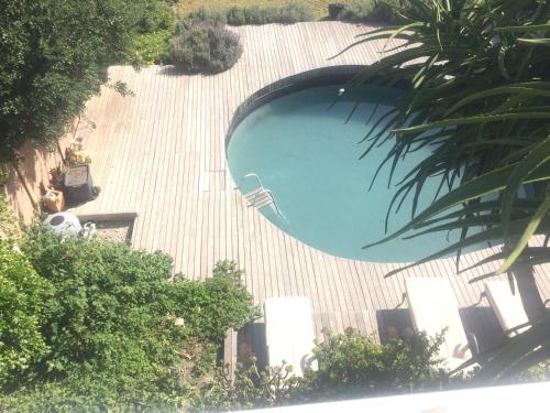 an overhead view of a swimming pool at Rustic Beach House 300 Steps from the Ocean in Cape Town