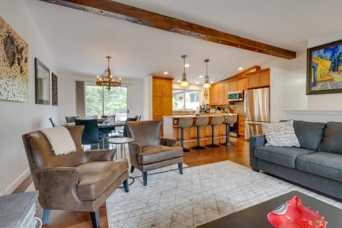 a living room with a couch and chairs and a kitchen at Kenmore Retreat with Shared Hot Tub - 1 Mi to Lake! in Kenmore