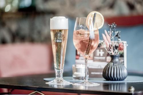 two glasses of champagne sitting on a table at Hotel Tyrolerhof in Sölden