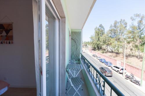 a balcony with a view of a street at FLH Alcântara Comfy Flat with Balcony in Lisbon