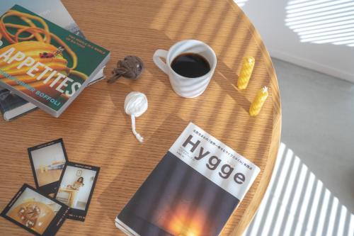 a coffee table with a book and a cup of coffee at FUN - Vacation STAY 48765v in Kanazawa