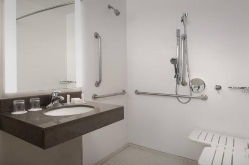 a bathroom with a sink and a shower at SpringHill Suites by Marriott Portland Hillsboro in Hillsboro