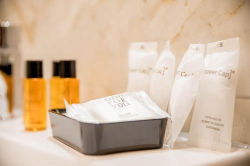 a box of soap sitting on a counter with bottles of soap at RESIDENCE VILLA TOTA in Spoleto