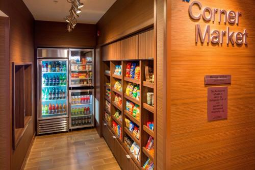 a grocery store aisle with a corner market refrigerator at Fairfield Inn & Suites by Marriott Hershey Chocolate Avenue in Hershey