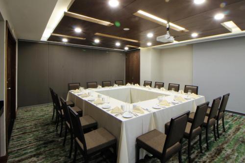 a conference room with a large white table and chairs at Holiday Inn Monterrey Valle by IHG in Monterrey
