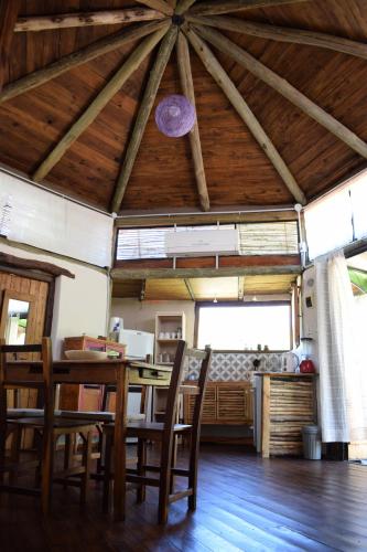 a dining room with a table and some chairs at Hexágono de San Javier in San Javier