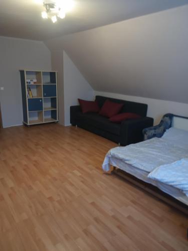 Postel nebo postele na pokoji v ubytování Patak apartman