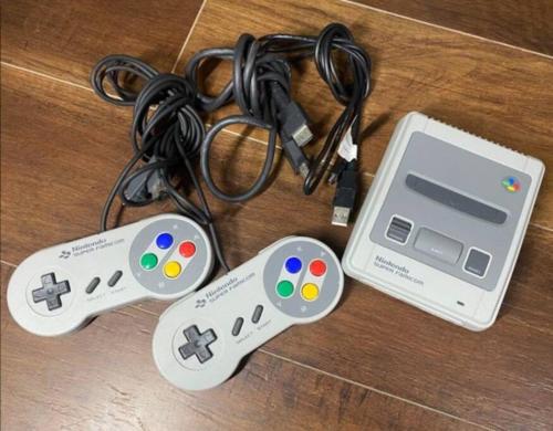 two video game controllers and a nintendo wii game system at 貸別荘せせらぎ in Taga