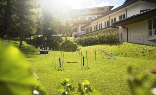 an empty playground in a yard next to a building at Bergresort Seefeld in Seefeld in Tirol
