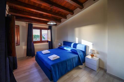 Ένα ή περισσότερα κρεβάτια σε δωμάτιο στο Agriturismo Case Rapputi