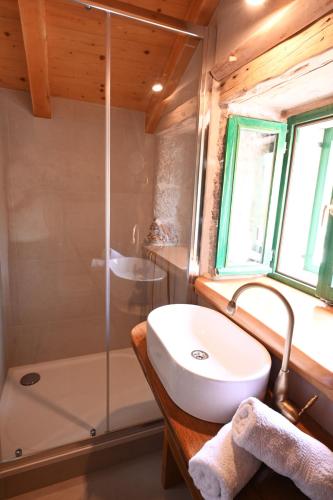 a bathroom with a sink and a shower at Villa Teza Hvar in Hvar