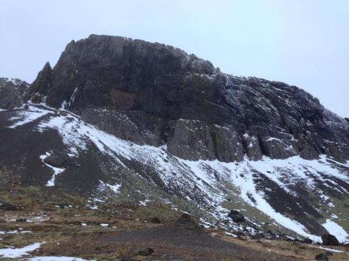 a mountain with snow on the side of it at Kría Cottages in Skeljabrekka
