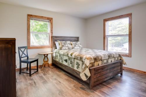 A bed or beds in a room at Wooded Hancock Home Near Ski and Snowmobile Trails!