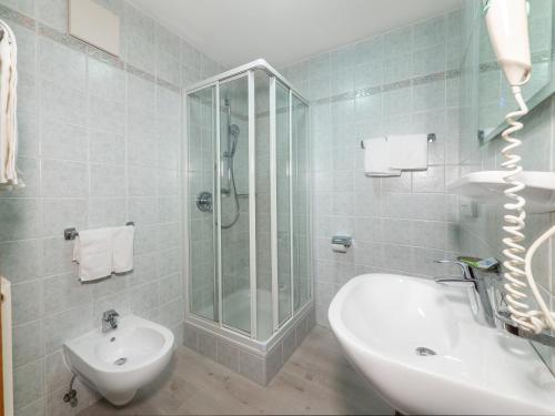 a bathroom with a shower and a sink and a toilet at B&B MARINA contacless check in in Santa Cristina in Val Gardena