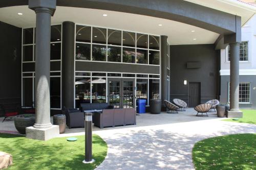 a large building with a lot of windows at La Quinta by Wyndham Dallas - Addison Galleria in Addison