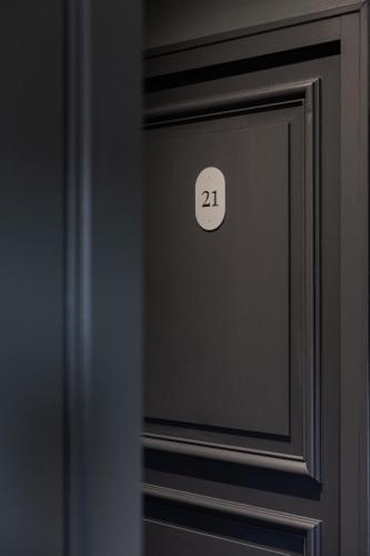 a close up of a door with the number at Hotel Porte Brunet in Saint-Émilion
