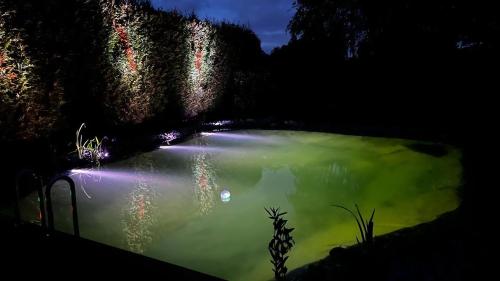 a large body of water with lights on it at Fewo Plüschmors in Dornum