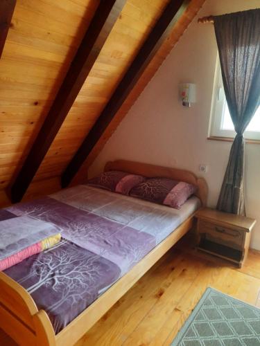 Postel nebo postele na pokoji v ubytování Kućica na Tari