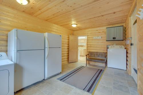 a kitchen with a refrigerator and a stove at Spacious Winter Retreat with River Access and Kayaks! in Winter