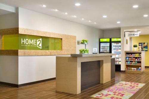 a lobby of a home store with a counter at Home2 Suites by Hilton Cincinnati Liberty Township in Wetherington