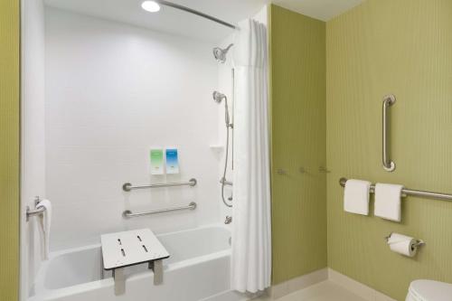 a bathroom with a shower and a toilet at Home2 Suites By Hilton El Paso Airport in El Paso