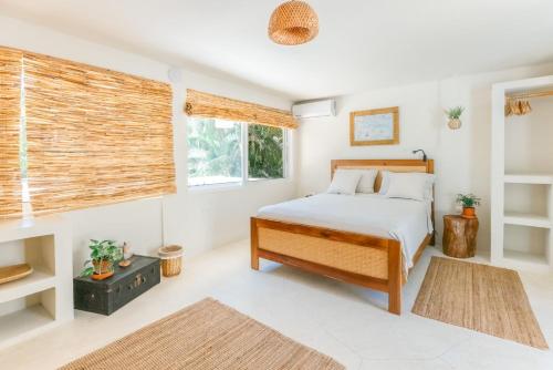 Postel nebo postele na pokoji v ubytování Kibayo Lagoon Villa