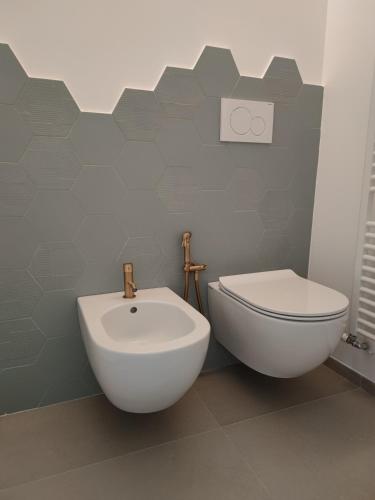 a bathroom with a toilet and a bidet at Sfumature D'aMare in Monopoli