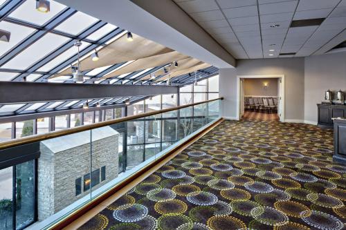 a large room with glass windows and a large ceiling at DoubleTree by Hilton Fairfield Hotel & Suites in Fairfield