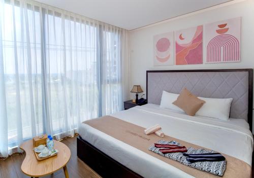 Voodi või voodid majutusasutuse KIKOZO DA NANG Hotel toas