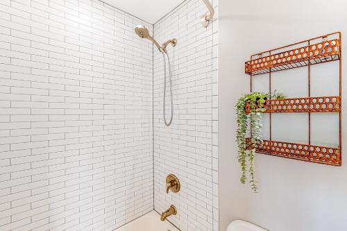 a bathroom with a shower with white subway tiles at City View in Atlanta