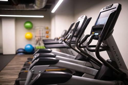 a row of exercise bikes in a gym at Motto by Hilton Philadelphia Rittenhouse Square in Philadelphia