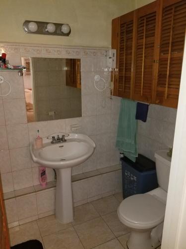 a bathroom with a sink and a toilet at 212 Goldenview in Saint James