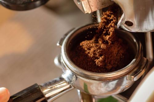 a person is pouring coffee into a cup at Hilton Birmingham Downtown at UAB in Birmingham