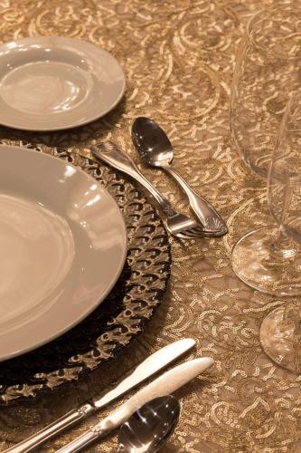 a table with plates and silverware on a table at Hilton Birmingham Downtown at UAB in Birmingham