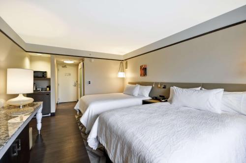 two beds in a hotel room at Hilton Garden Inn Detroit Troy in Troy