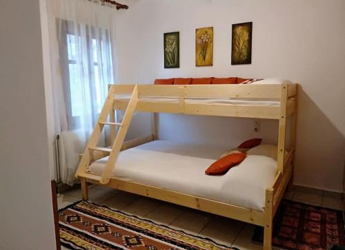 a couple of bunk beds in a room at Kalliopi's House in Mandrakion