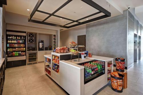 a kitchen with a drink counter in a store at Hilton Garden Inn Lansing West in Lansing