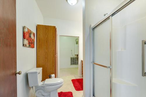 a bathroom with a toilet and a glass shower door at Paris Vacation Rental about 15 Mi to Mount Magazine! in Paris