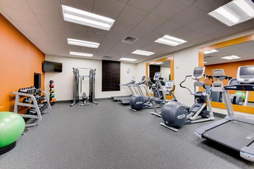 a gym with several treadmills and cardio equipment at Hilton Garden Inn North Houston Spring in Spring