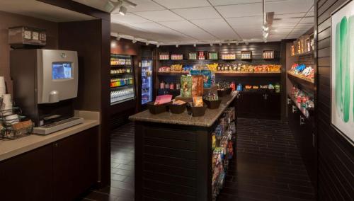 a bar in a store with a drink dispenser at Hilton Garden Inn Austin Downtown in Austin
