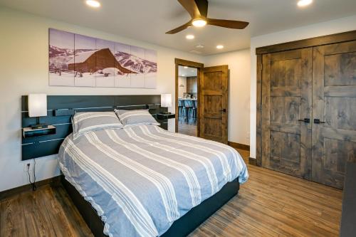 a bedroom with a bed and a ceiling fan at Steamboat Springs Apt with Views, 15 Mi to Skiing! in Steamboat Springs