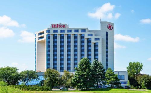 a hotel with a hilton sign on top of a building at Hilton Minneapolis-St Paul Airport in Bloomington